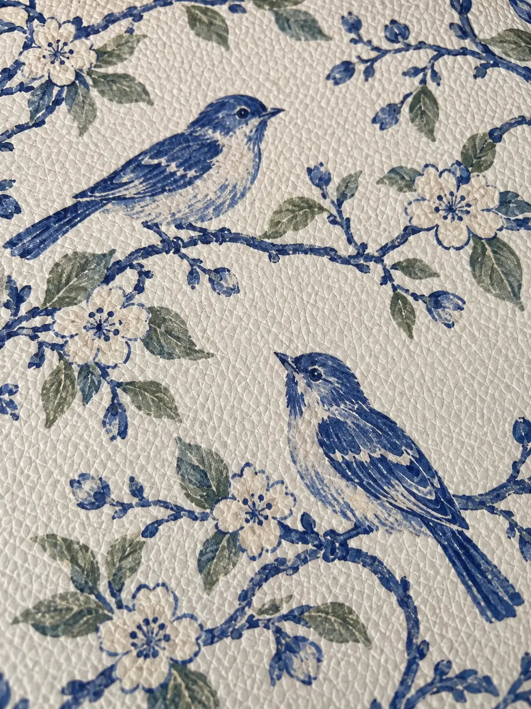 Fine grain on printed vegan leather; botanical artwork digitally adapted
