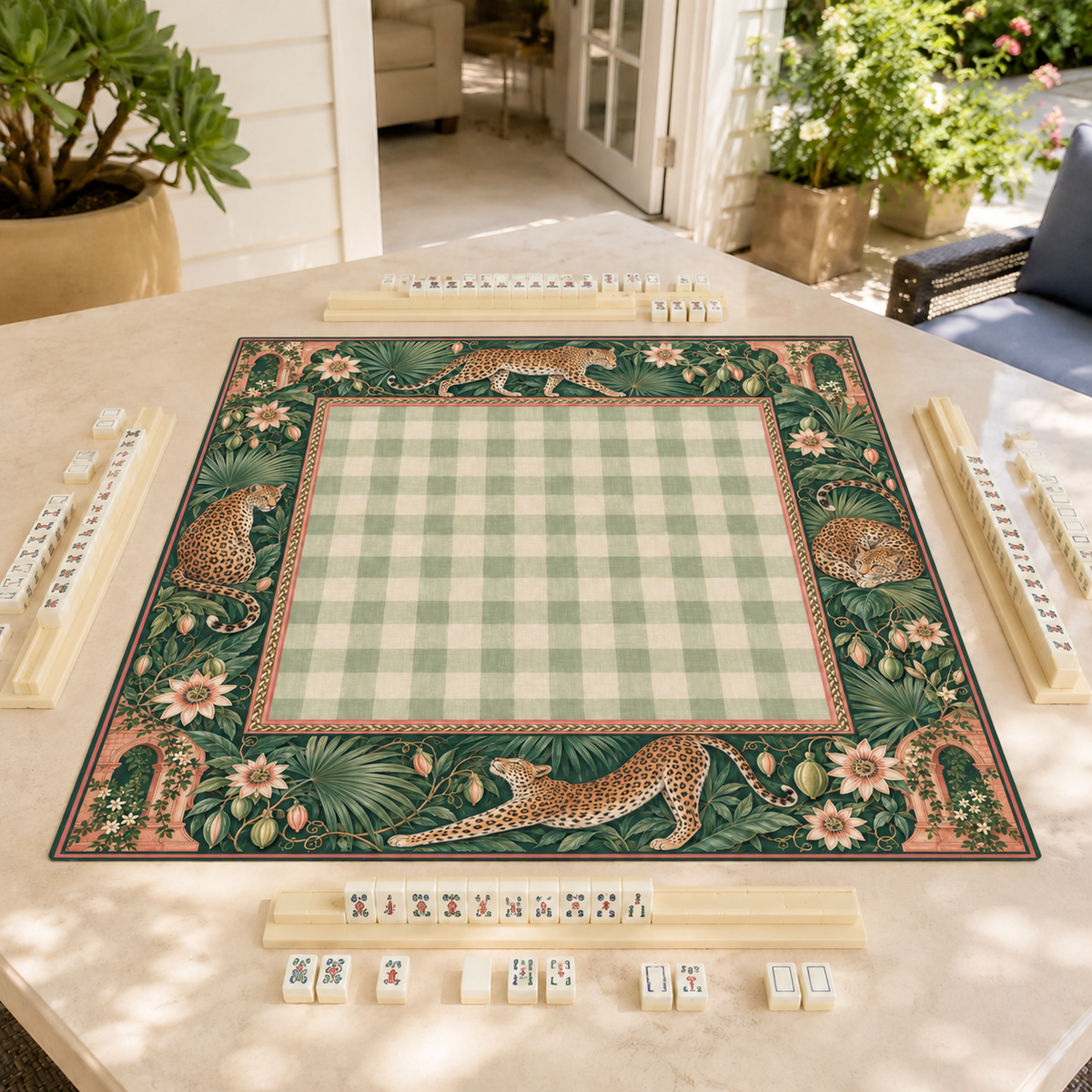 Leopard and sage gingham vegan leather Mahjong mat on a sunlit patio table