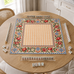 Vegan leather Mahjong mat with pomegranates and a peach checkerboard center on a bright kitchen table