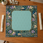 Teal vegan leather Mahjong mat with peacocks, purple irises and Art Nouveau florals overhead on an oak table