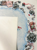 Cream suede backing beside the winter skating pond Mahjong mat with snowy greenery, red scarf and sled details