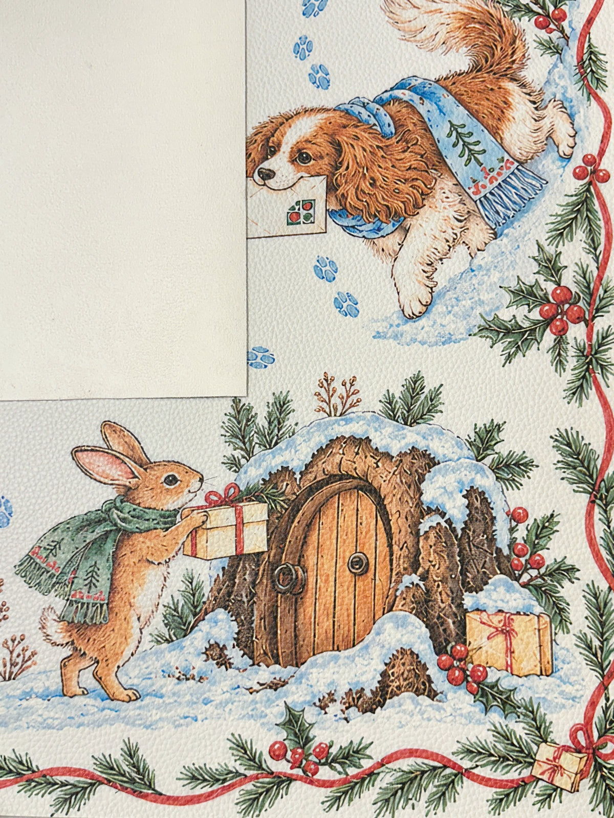 Cream suede backing beside the winter animal Mahjong mat with a scarf-wearing rabbit, gifts and a snowy wooden door