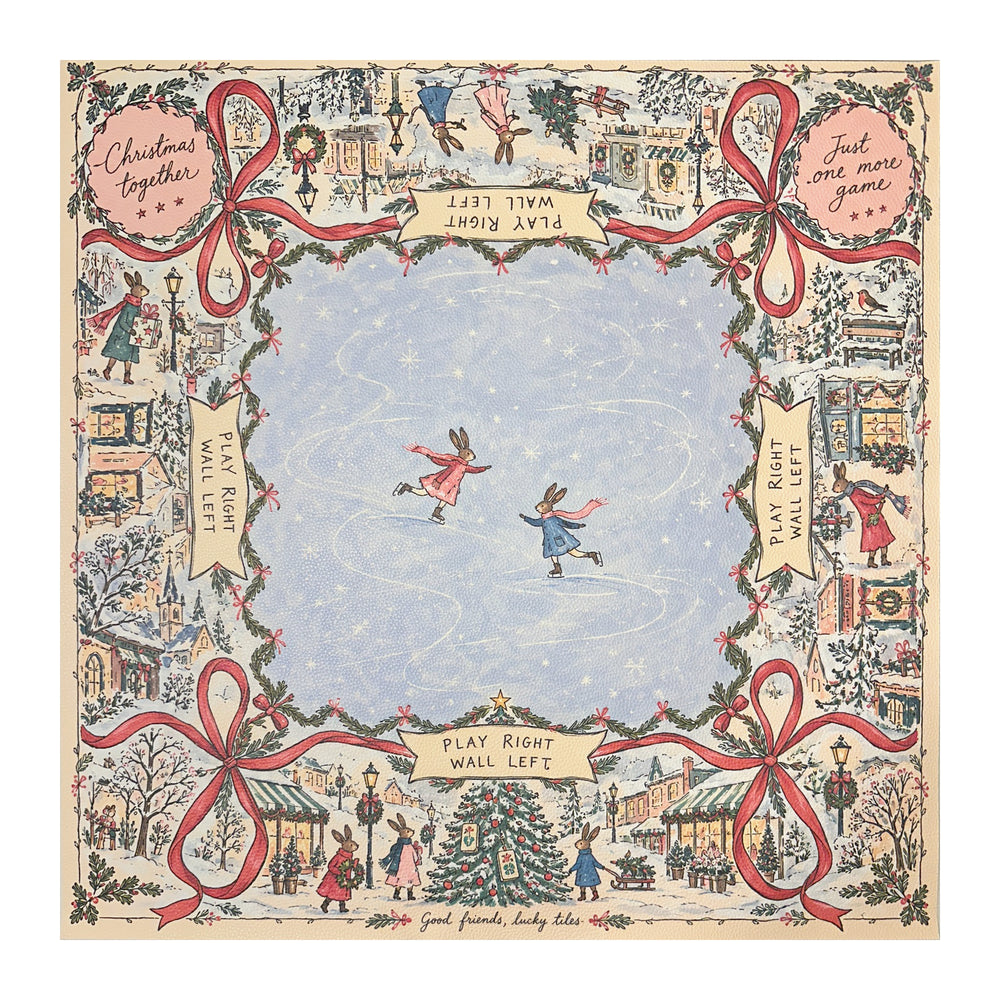 Winter rabbit Christmas Mahjong mat with a pale blue skating center, snowy village border, Christmas trees and red bows