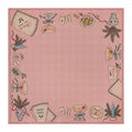 Pink Christmas Mahjong mat with a checked center, cocktail glasses, Merry Mahj napkins, blue candles and Mahjong tiles