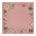 Pink Christmas Mahjong mat with a checked center, cocktail glasses, Merry Mahj napkins, blue candles and Mahjong tiles
