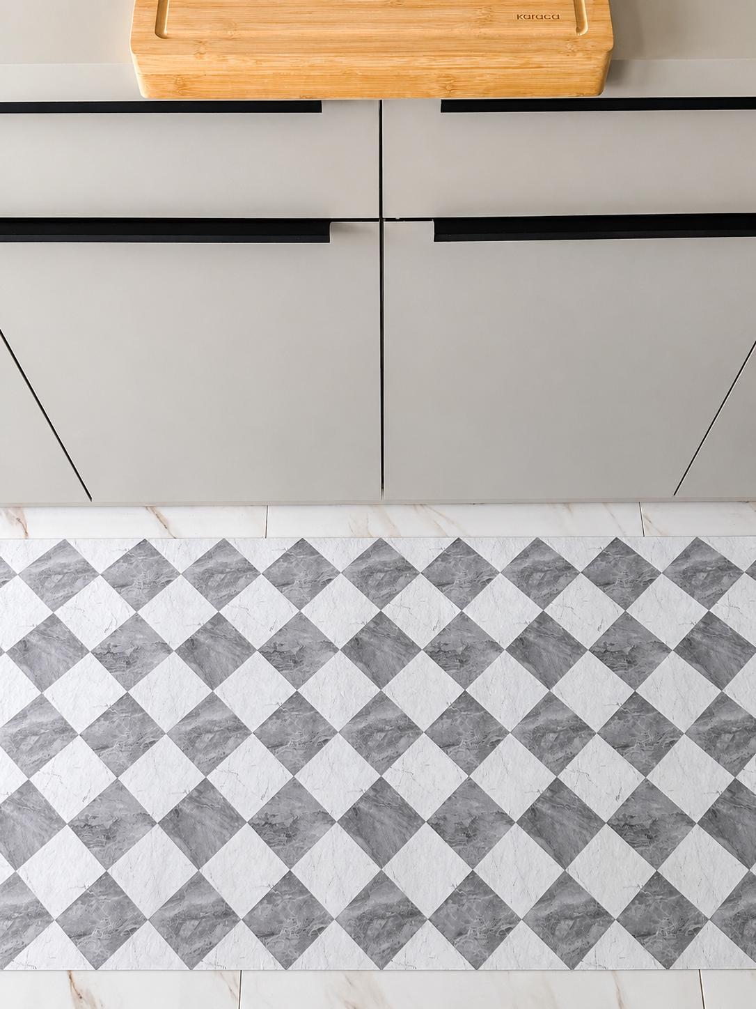 Gray and white marble checkered kitchen runner mat with a modern geometric pattern, displayed in a minimalist kitchen interior.