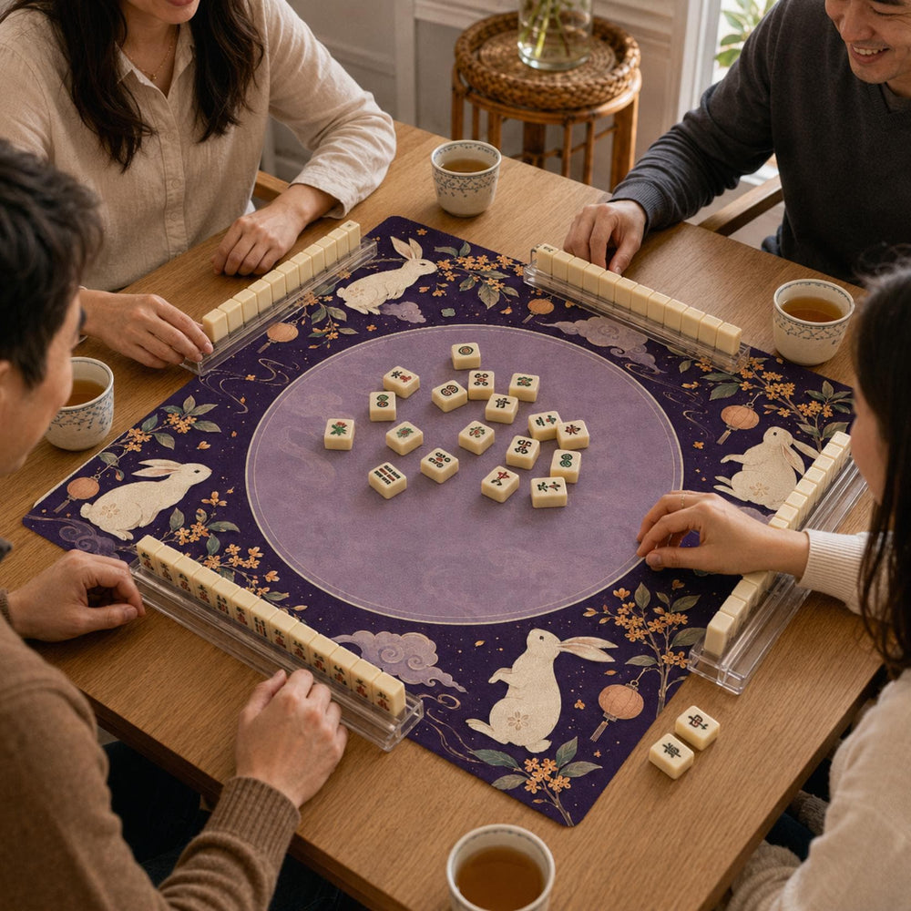 Rabbit silhouettes, lanterns and moon motifs decorate the deep purple border around a lighter circular center on this Mahjong mat.