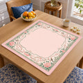 Peonies and birds decorate a green-and-cream ornamental border around the blush pink center of this chinoiserie Mahjong mat.
