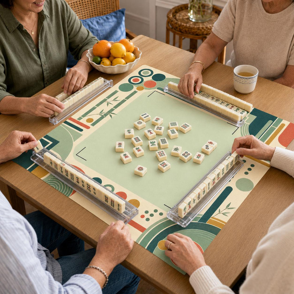 Jade green lines, terracotta circles and cream geometric blocks border the light green center of this mid-century Mahjong mat.
