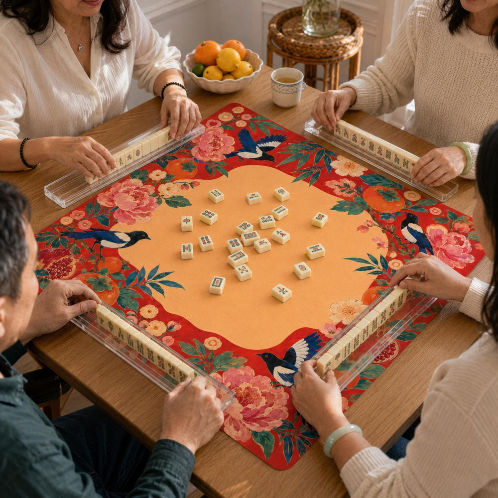 Red peonies, persimmons and magpies form a bold folk-art border around the warm golden center of this Mahjong mat.