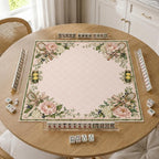 Tennis rackets, balls and pink flowers decorate the corners of a cream preppy Mahjong mat.