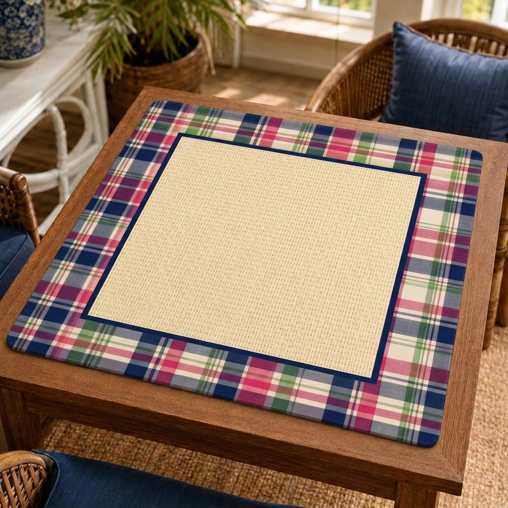 Colorful plaid bands and a navy inner border frame a beige rattan-look printed center on this preppy Mahjong mat.