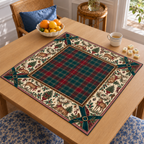 Angled table view of the Christmas Mahjong mat with red-and-green tartan center, deer, holly, Christmas trees and dark green corner bows